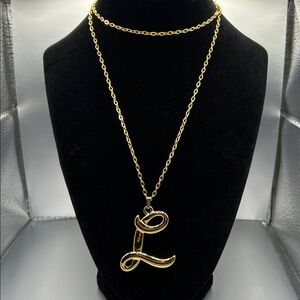 Avon letter “L” pendant necklace. 14” chain. Never worn.